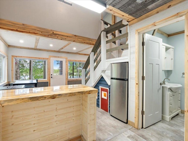 6274 Azalea Rd, Motley Twp, MN 56466 - kitchen with freestanding refrigerator, light wood finished floors, a sink, recessed lighting, and baseboards