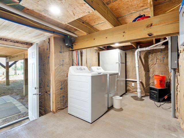 6274 Azalea Rd, Motley Twp, MN 56466 - below grade area featuring washing machine and clothes dryer and freestanding refrigerator