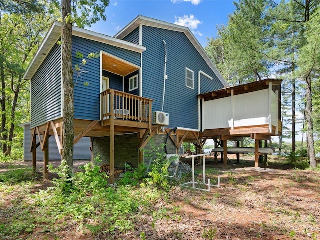 6274 Azalea Rd, Motley Twp, MN 56466 - back of property with a cooling unit and a wooden deck