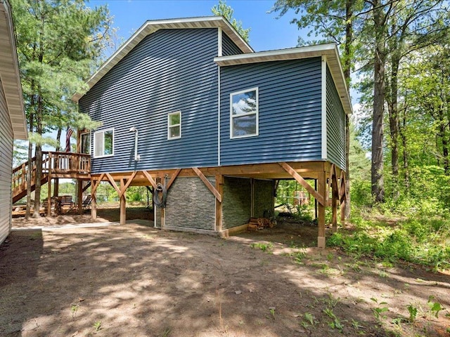 6274 Azalea Rd, Motley Twp, MN 56466 - view of side of property with a carport, driveway, stairs, and a wooden deck