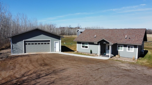 92620 Palon Rd, Sturgeon Lake, MN 55783 - ranch-style home with an outdoor structure, a detached garage, and roof with shingles