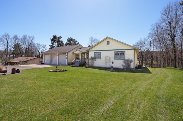 view of front of home with concrete driveway, cooling unit, and a front yard