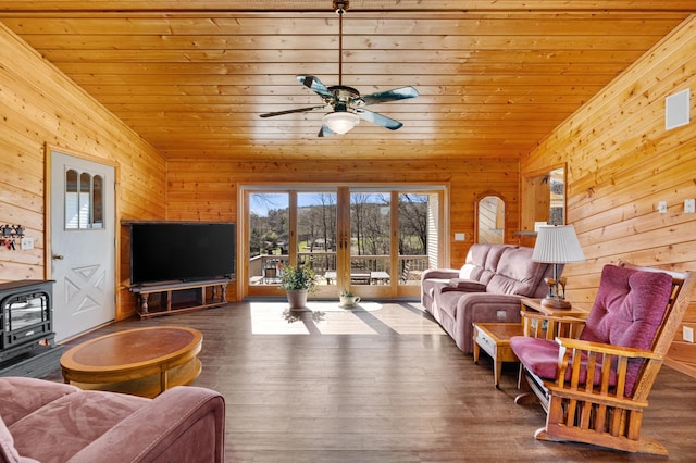 living room with wood ceiling, a ceiling fan, french doors, wood walls, and wood finished floors