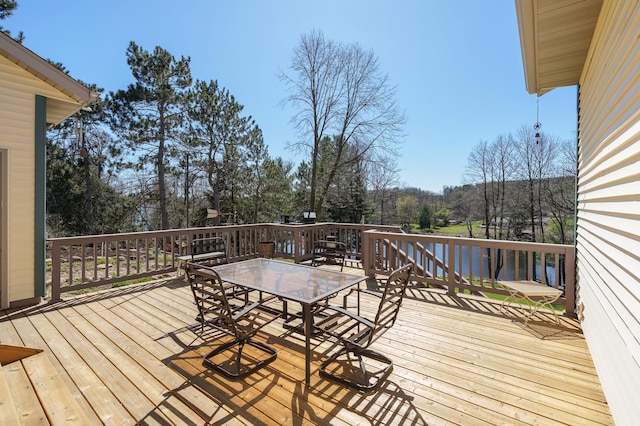 wooden deck with outdoor dining area