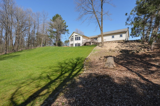 view of yard with a wooden deck and stairs