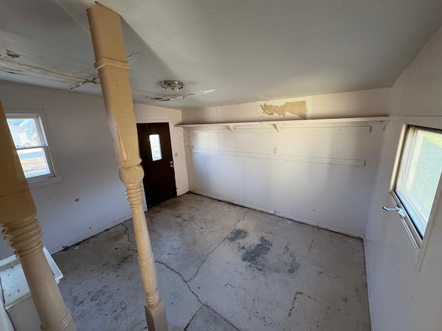 interior space featuring unfinished concrete floors