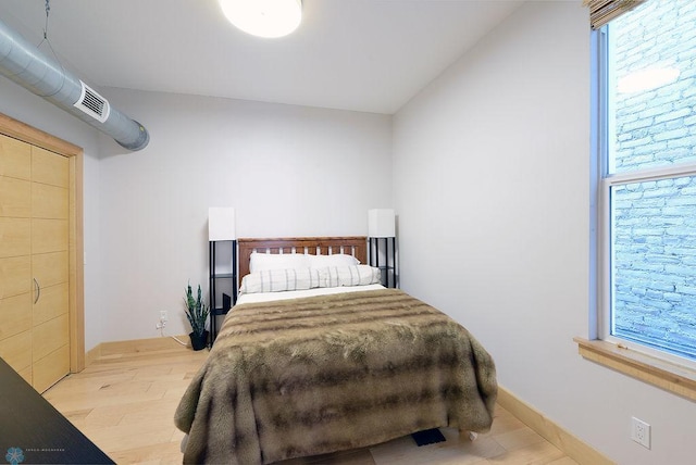 319 Broadway N Unit 202, Fargo, ND 58102 - bedroom with wood finished floors