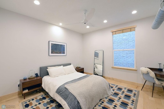 319 Broadway N Unit 202, Fargo, ND 58102 - bedroom featuring recessed lighting, a ceiling fan, wood finished floors, and baseboards