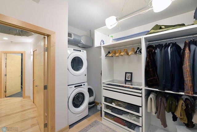 319 Broadway N Unit 202, Fargo, ND 58102 - laundry area with estacked washer and dryer and wood finished floors