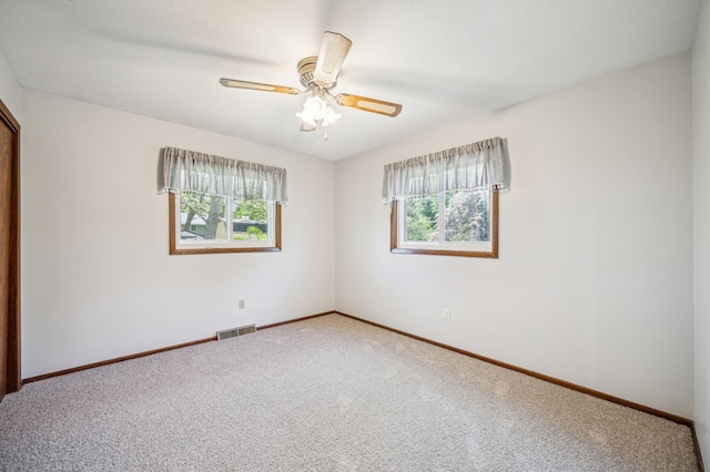 unfurnished bedroom with carpet floors, baseboards, and ceiling fan