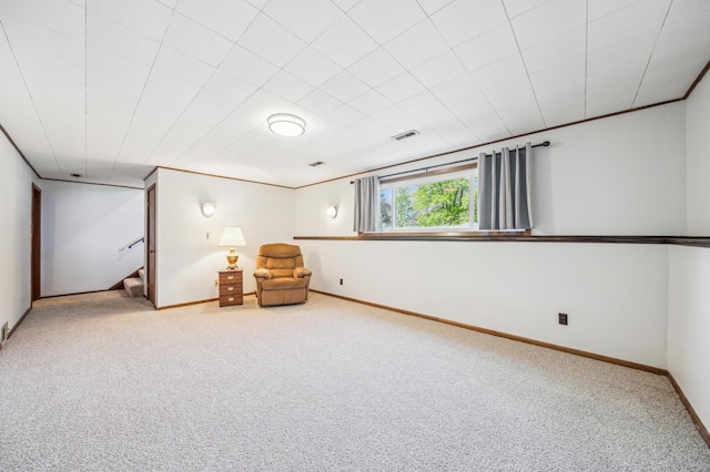 unfurnished room featuring carpet, stairs, and baseboards