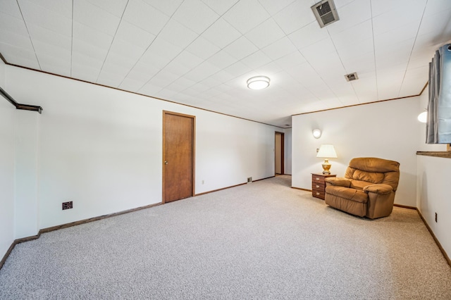 living area with carpet and baseboards