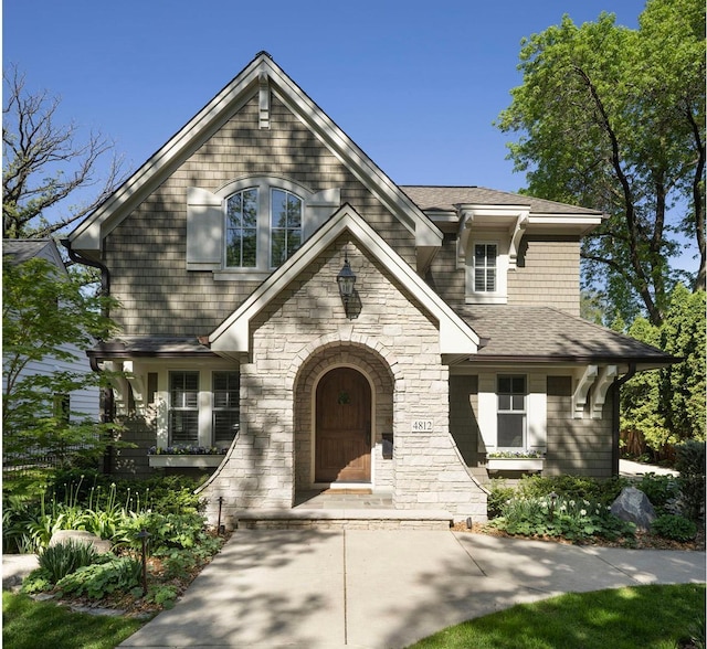 4812 Maple Rd, Edina, MN 55424 - view of front facade with stone siding and a shingled roof