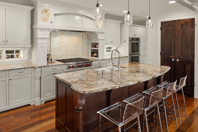 4812 Maple Rd, Edina, MN 55424 - kitchen featuring a sink, dark wood-style floors, appliances with stainless steel finishes, backsplash, and white cabinetry