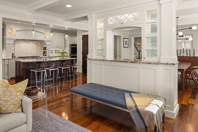 4812 Maple Rd, Edina, MN 55424 - living area featuring a decorative wall, crown molding, dark wood finished floors, arched walkways, and recessed lighting