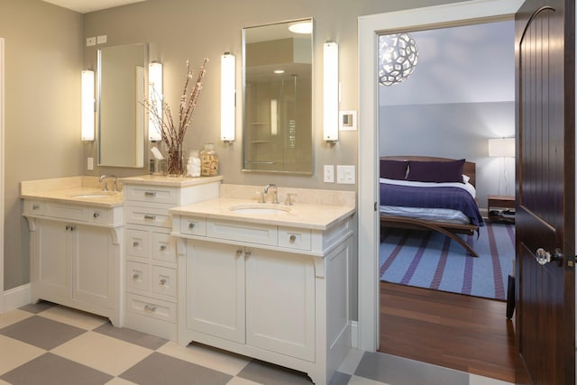 4812 Maple Rd, Edina, MN 55424 - full bathroom with tile patterned floors, double vanity, and ensuite bathroom