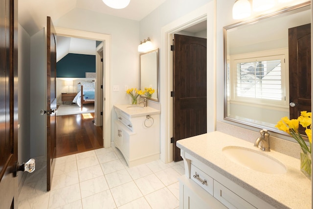 4812 Maple Rd, Edina, MN 55424 - ensuite bathroom with two vanities and tile patterned floors