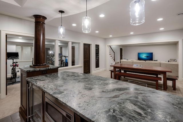 4812 Maple Rd, Edina, MN 55424 - kitchen with stainless steel microwave, a center island, beverage cooler, recessed lighting, and light colored carpet