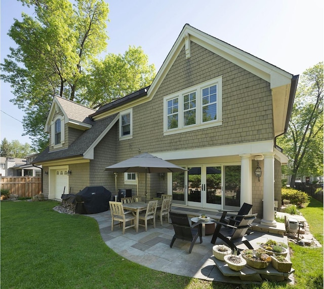 4812 Maple Rd, Edina, MN 55424 - back of property with a patio, a garage, french doors, and roof with shingles
