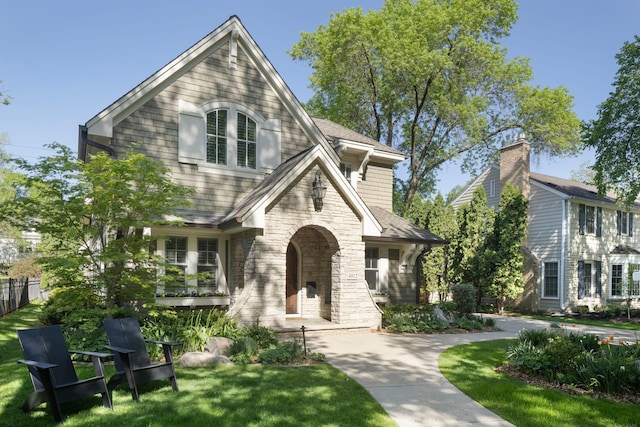 4812 Maple Rd, Edina, MN 55424 - view of front facade featuring stone siding and a front lawn