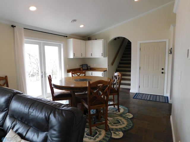 dining area featuring crown molding, recessed lighting, french doors, and stone tile flooring