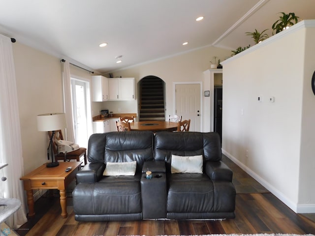 living room with vaulted ceiling, baseboards, ornamental molding, and dark wood-style floors