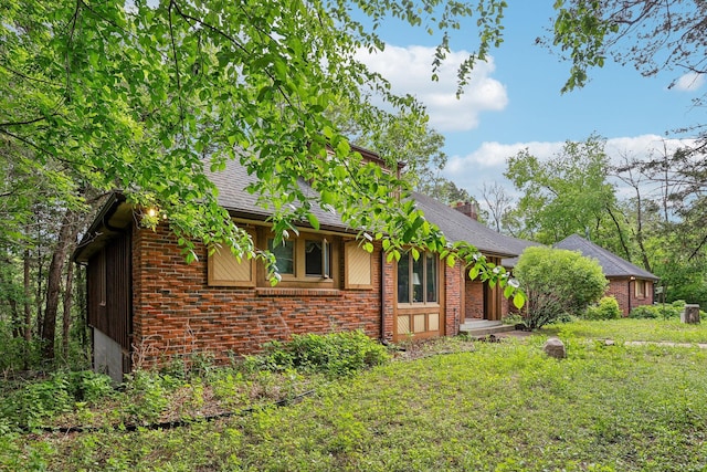 4810 Marystone Blvd NW, Andover, MN 55304 - view of side of home with brick siding and roof with shingles