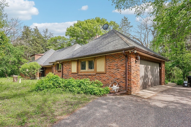 4810 Marystone Blvd NW, Andover, MN 55304 - view of front facade with brick siding, a shingled roof, asphalt driveway, and a garage