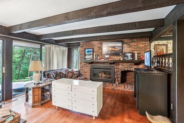 4810 Marystone Blvd NW, Andover, MN 55304 - living room featuring beam ceiling, hardwood / wood-style flooring, and a fireplace