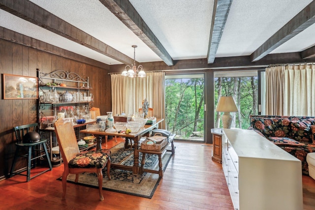 4810 Marystone Blvd NW, Andover, MN 55304 - dining room featuring a textured ceiling, beamed ceiling, a chandelier, wooden walls, and wood-type flooring