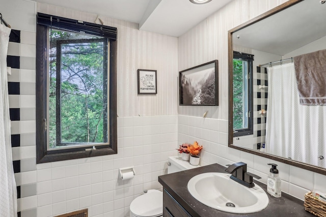4810 Marystone Blvd NW, Andover, MN 55304 - full bathroom with tile walls, vanity, toilet, and curtained shower