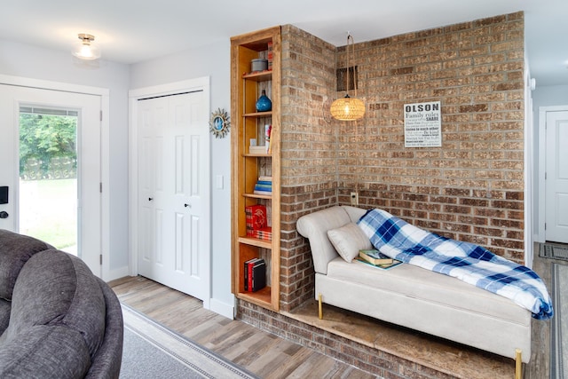 sitting room featuring wood finished floors and baseboards