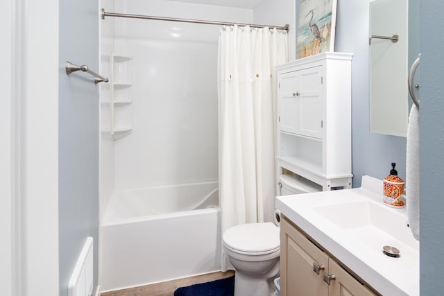 bathroom featuring toilet, shower / tub combo with curtain, and vanity