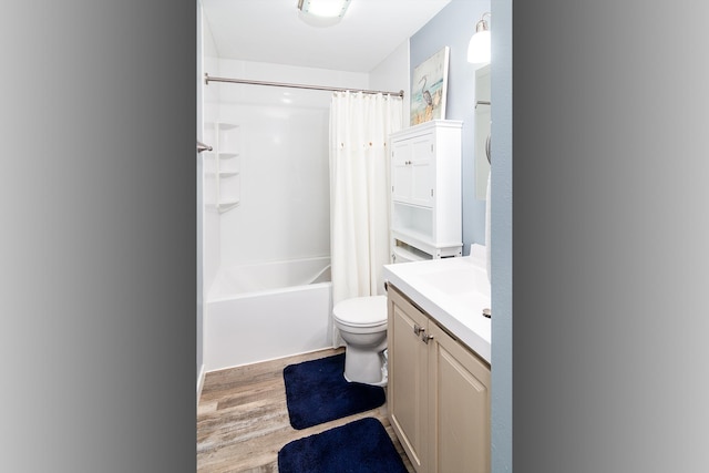 full bathroom featuring toilet, vanity, shower / bath combination with curtain, and wood finished floors