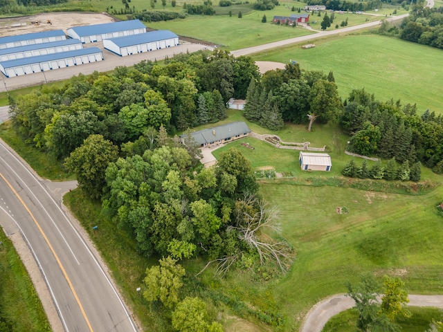 birds eye view of property with a rural view
