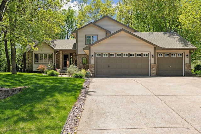 view of front of property featuring an attached garage, brick siding, and driveway