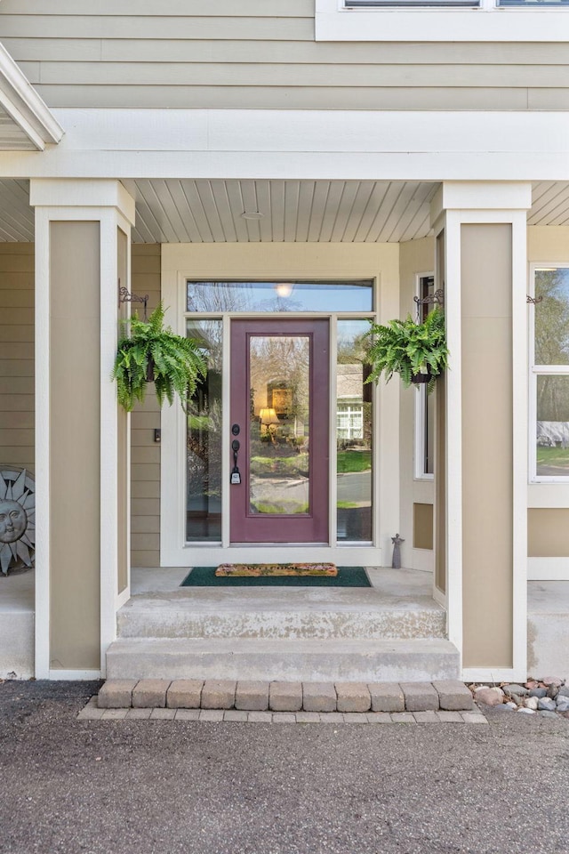 property entrance featuring covered porch