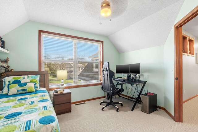 bedroom with baseboards, carpet flooring, and lofted ceiling