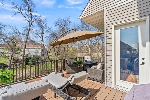 wooden terrace with an outdoor hangout area