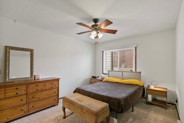 350 Ford Rd Unit 3, Saint Louis Park, MN 55426 - bedroom with light carpet, a textured ceiling, and a ceiling fan