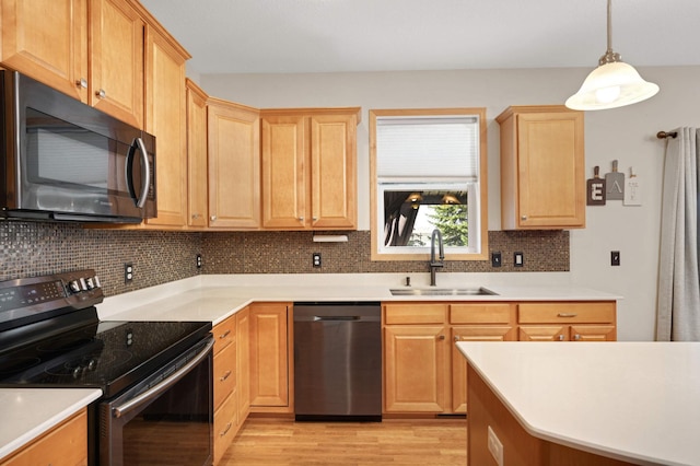 1810 Cherry Cir, Carver, MN 55315 - kitchen with stainless steel appliances, backsplash, light wood-type flooring, and light countertops