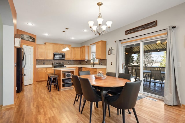 1810 Cherry Cir, Carver, MN 55315 - dining room featuring a chandelier, light wood-type flooring, and recessed lighting