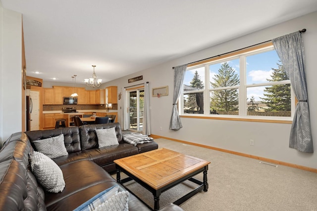 1810 Cherry Cir, Carver, MN 55315 - living area featuring a chandelier and carpet