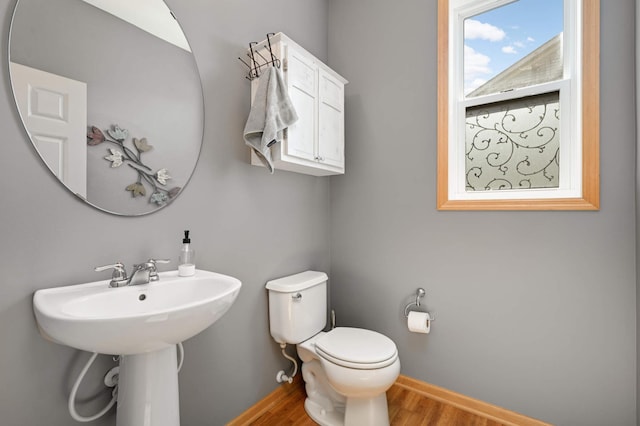 1810 Cherry Cir, Carver, MN 55315 - half bath featuring wood finished floors and toilet