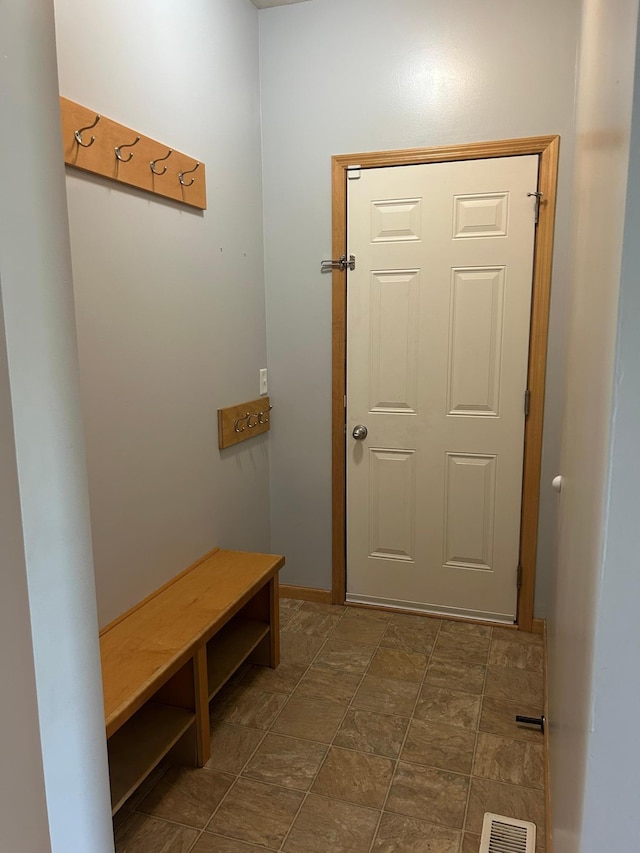 1810 Cherry Cir, Carver, MN 55315 - mudroom featuring dark stone finish flooring and baseboards