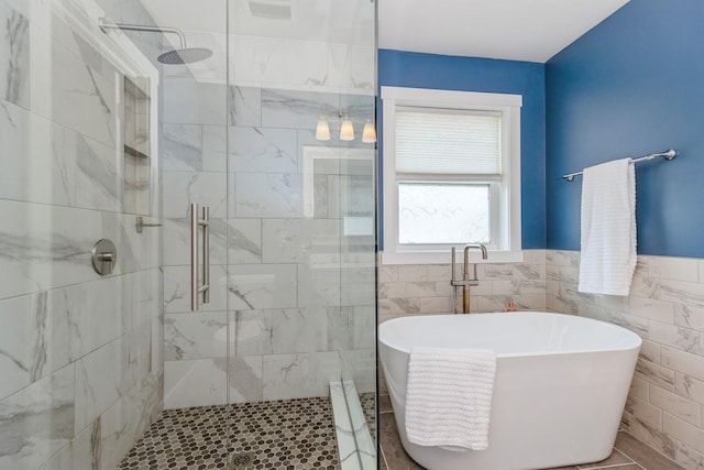 1810 Cherry Cir, Carver, MN 55315 - full bath with a soaking tub, a shower stall, tile walls, and wainscoting