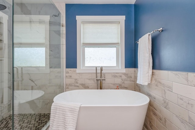 1810 Cherry Cir, Carver, MN 55315 - bathroom with a soaking tub, tile walls, a shower stall, and wainscoting