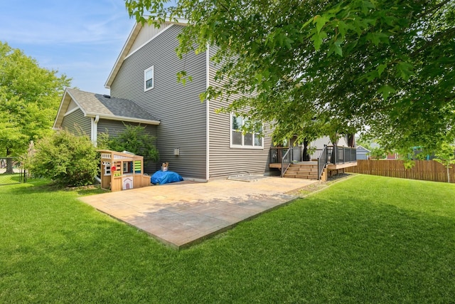 1810 Cherry Cir, Carver, MN 55315 - back of house with a patio area and a deck