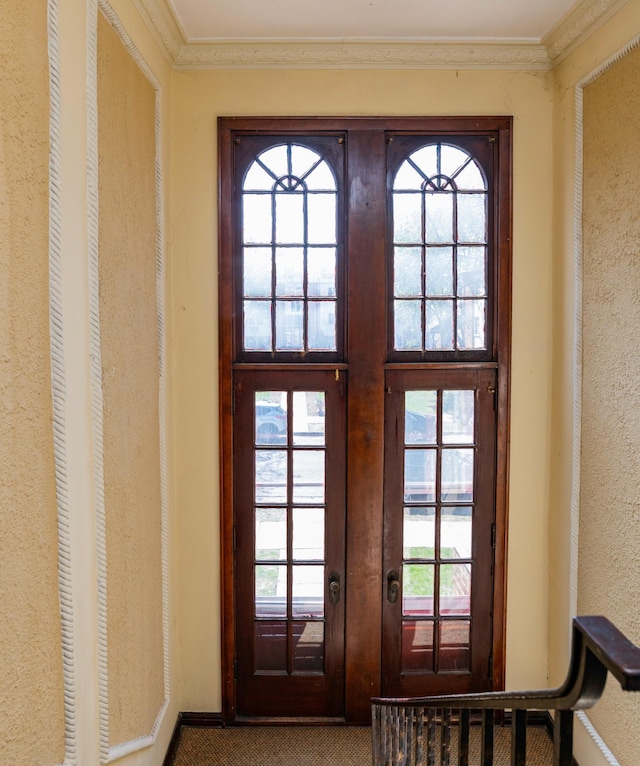 4415 Chowen Ave S Unit 201, Minneapolis, MN 55410 - entryway featuring french doors, carpet floors, crown molding, and a textured wall