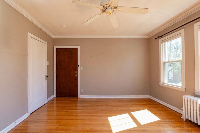 4415 Chowen Ave S Unit 201, Minneapolis, MN 55410 - unfurnished room with radiator, light wood-type flooring, ornamental molding, baseboards, and ceiling fan